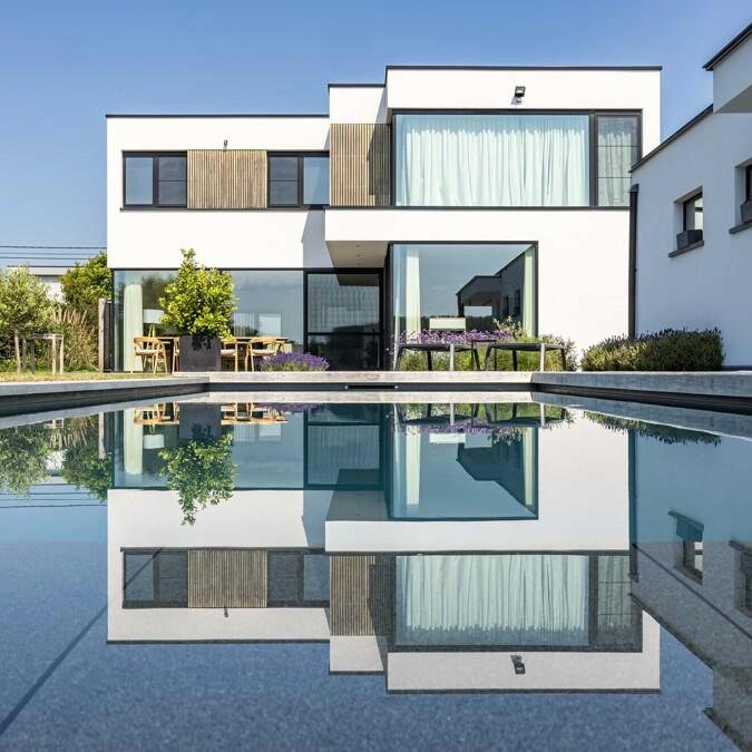 Totaalprojectzwembad - poolhouse - terrassen&nbsp;	In De Pinte realiseerden we dit stijlvol bet